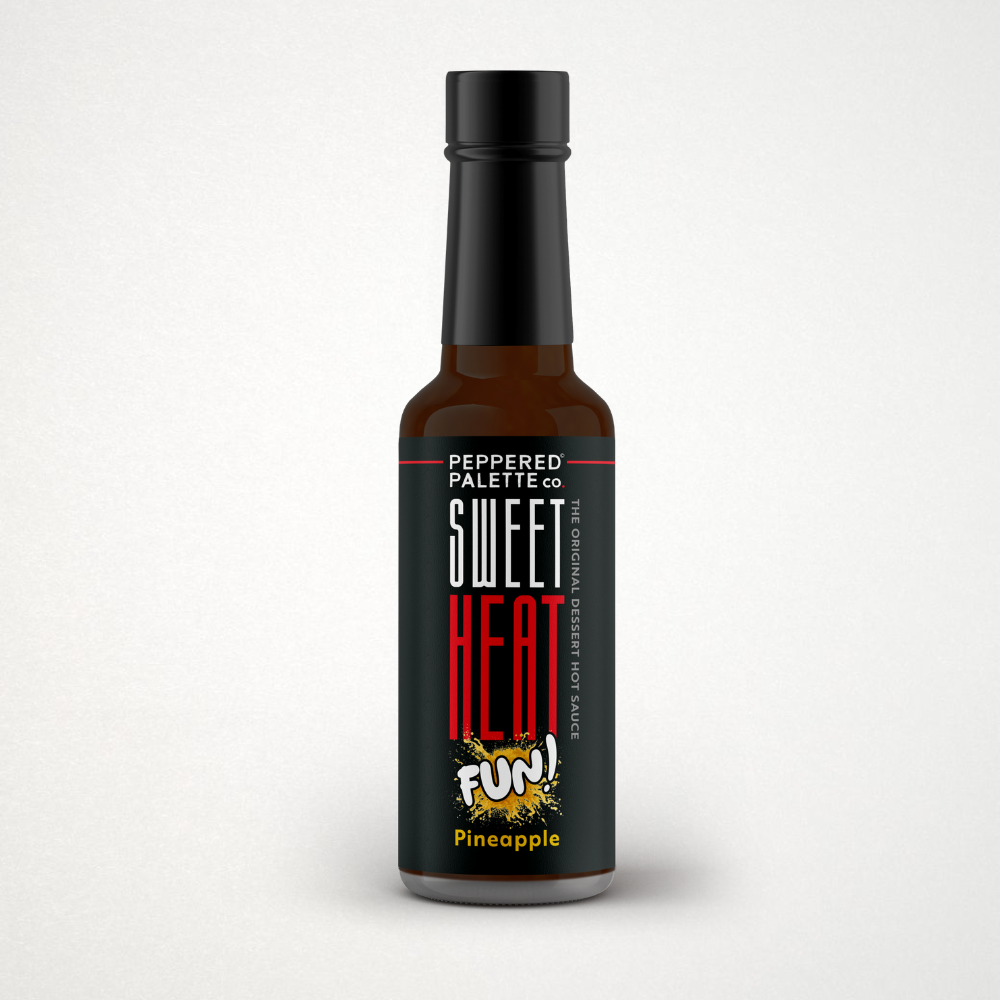 Bottle of 'Sweet Heat Fun!' pineapple hot sauce on a white background with a Great Taste 1-star award logo